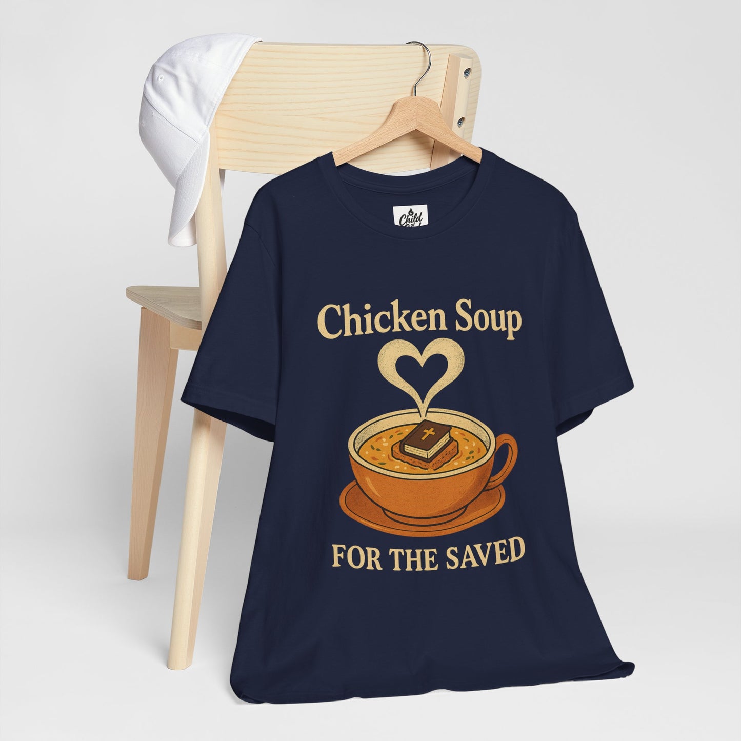 "Chicken Soup for the Saved" . Unisex Jersey Short Sleeve Tee - Casual Christian Graphic Shirt for Positive Vibes